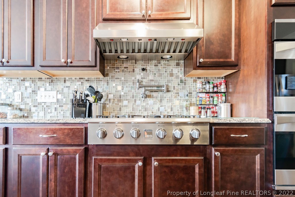 335 Turriff Way Cameron, NC 28326 - Photo 25 of 50 a kitchen with a stove top oven