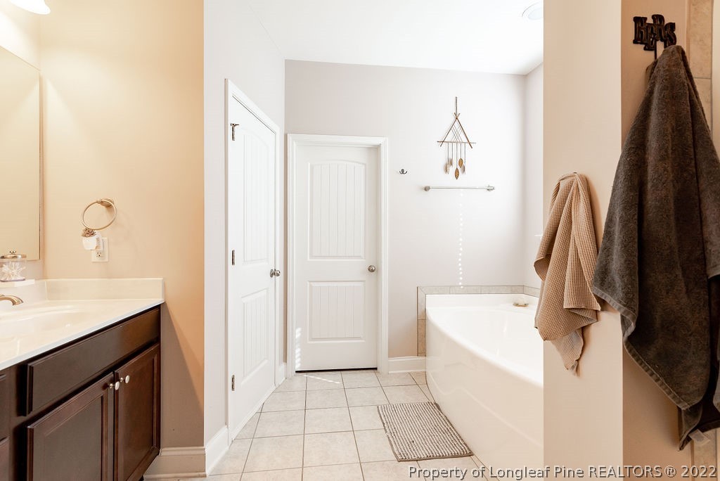 335 Turriff Way Cameron, NC 28326 - Photo 29 of 50 a bathroom with a sink a toilet and a tub