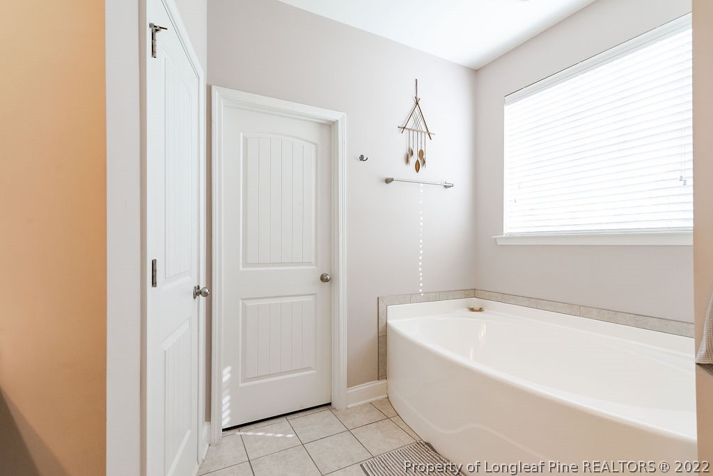 335 Turriff Way Cameron, NC 28326 - Photo 30 of 50 a white bath tub sitting next to a window