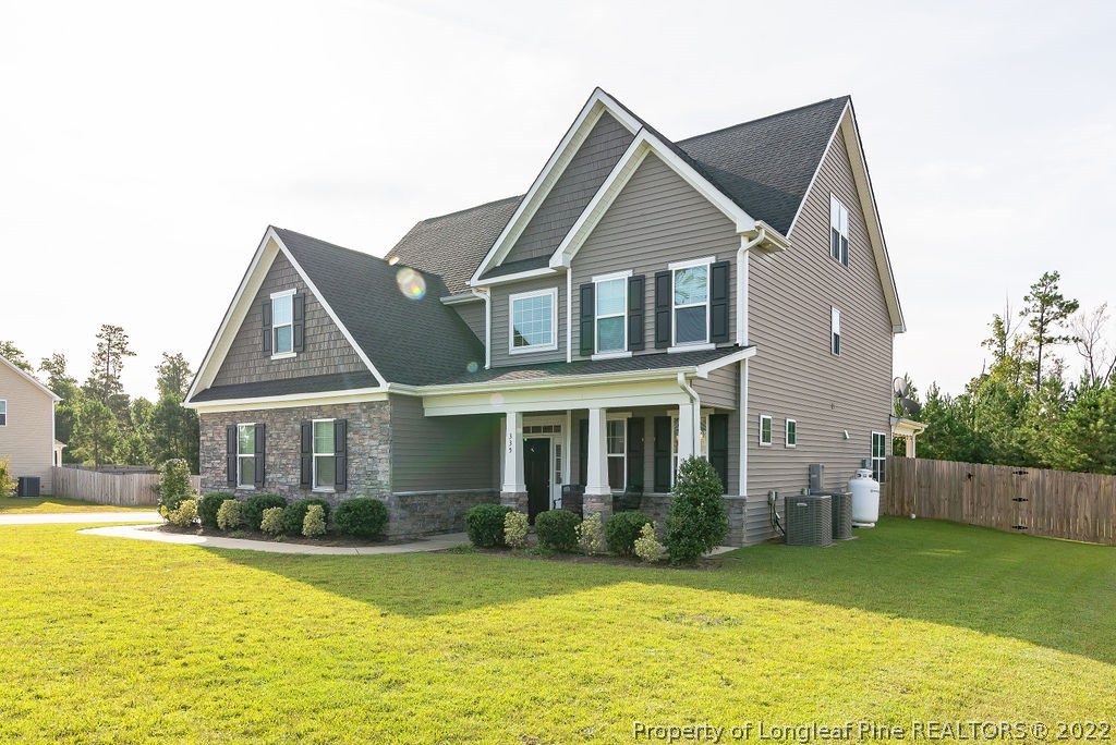 335 Turriff Way Cameron, NC 28326 - Photo 3 of 50 a front view of a house with a yard