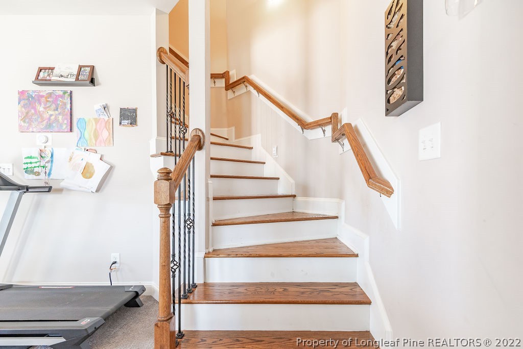 335 Turriff Way Cameron, NC 28326 - Photo 32 of 50 a view of staircase with white walls