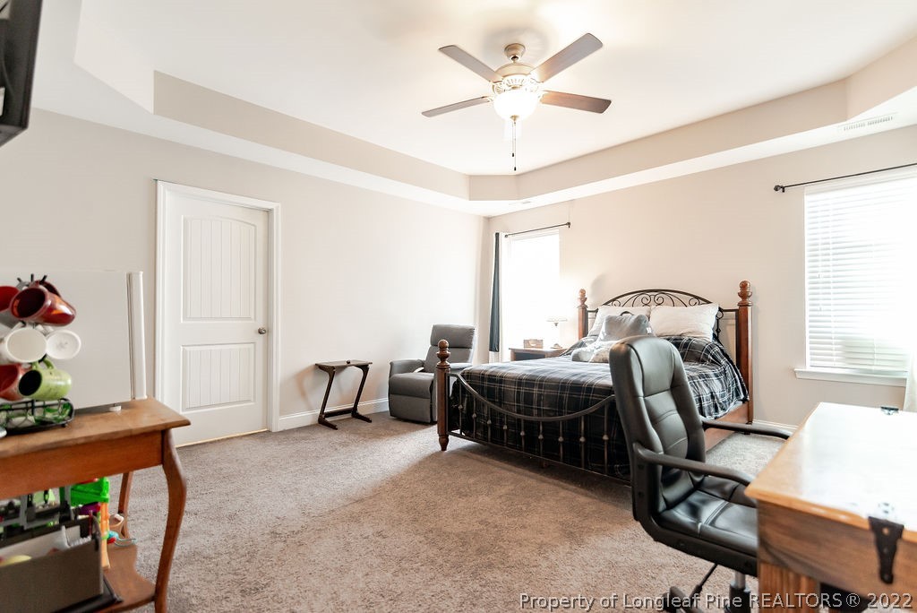 335 Turriff Way Cameron, NC 28326 - Photo 34 of 50 a bed room with a bed and a window
