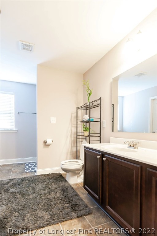 335 Turriff Way Cameron, NC 28326 - Photo 36 of 50 a bathroom with a sink a toilet and a mirror