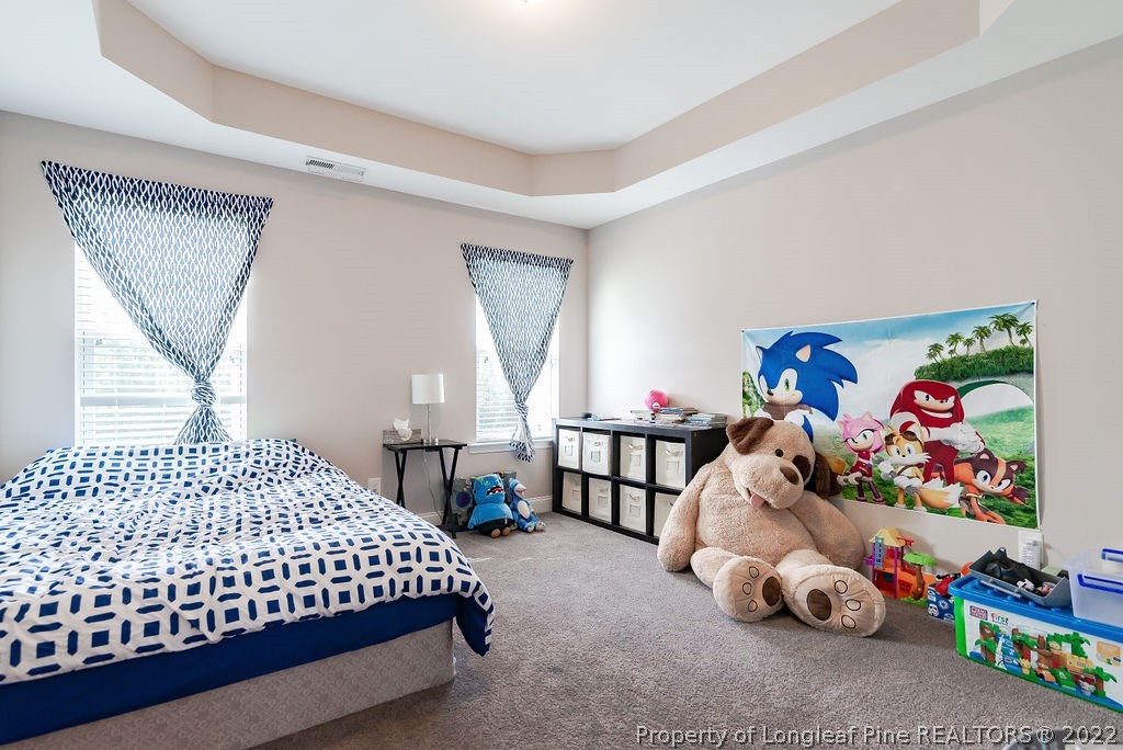 335 Turriff Way Cameron, NC 28326 - Photo 37 of 50 a bedroom with a bed and a window