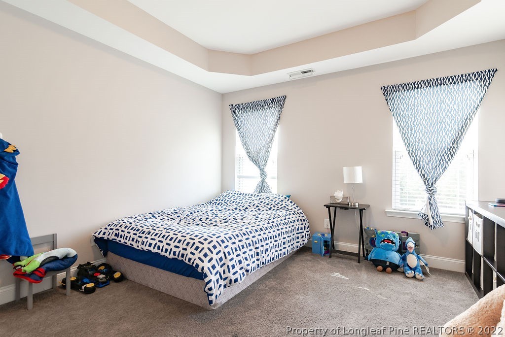 335 Turriff Way Cameron, NC 28326 - Photo 38 of 50 a bedroom with a bed and a window