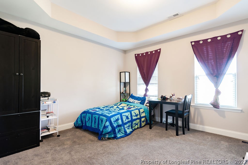 335 Turriff Way Cameron, NC 28326 - Photo 39 of 50 a bedroom with a bed and a window