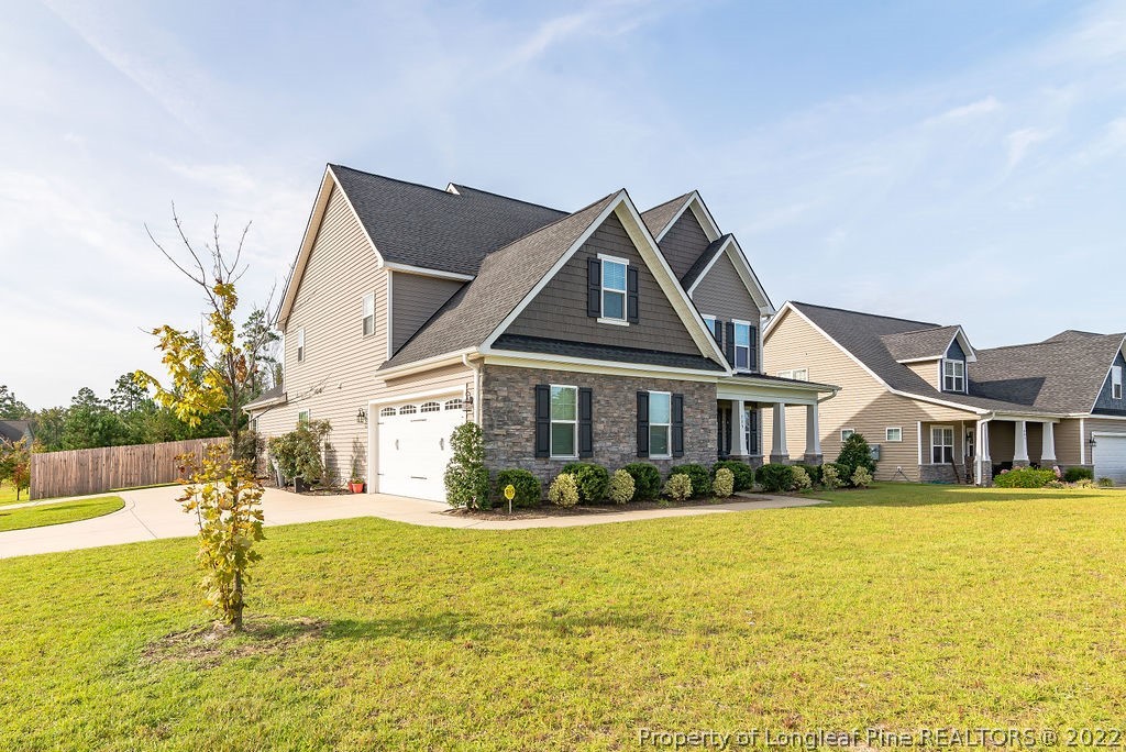 335 Turriff Way Cameron, NC 28326 - Photo 4 of 50 a front view of a house with swimming pool