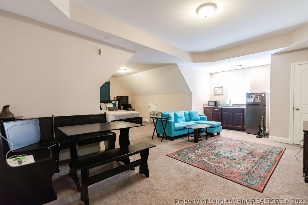 335 Turriff Way Cameron, NC 28326 - Photo 42 of 50 a living room with furniture and a rug