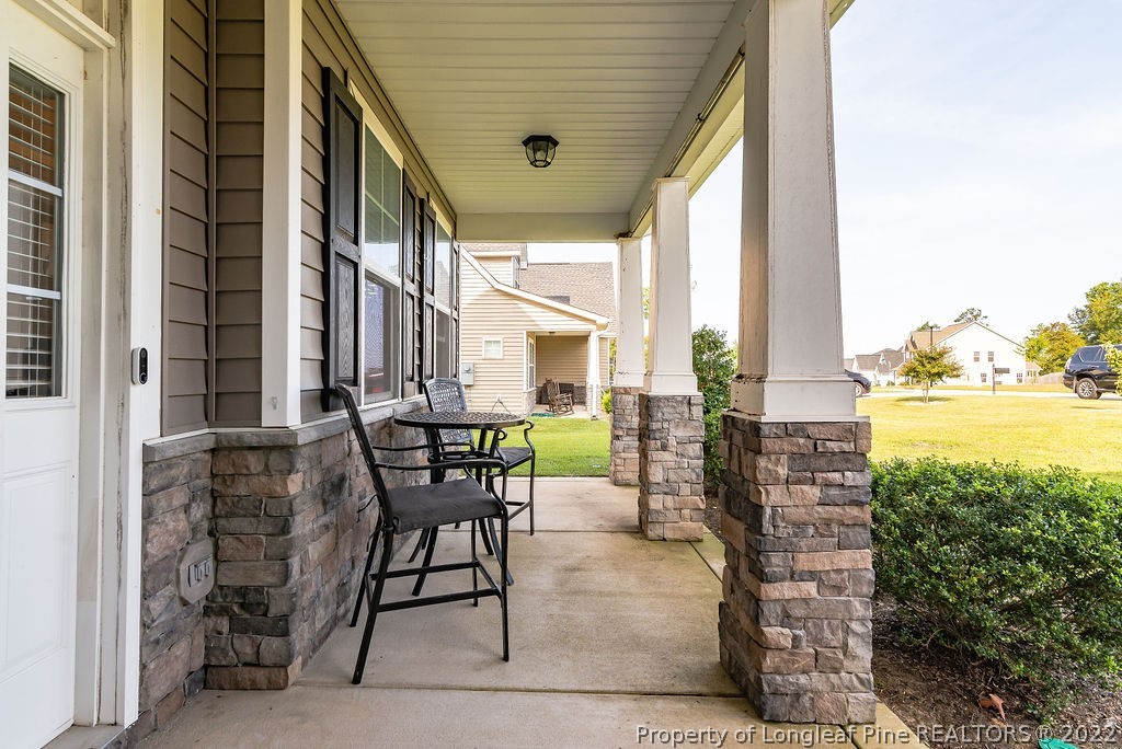 335 Turriff Way Cameron, NC 28326 - Photo 6 of 50 a view of an outdoor dining space with a table and chairs