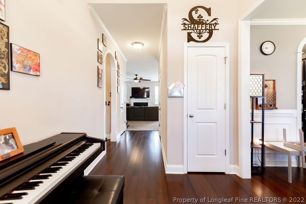 335 Turriff Way Cameron, NC 28326 - Photo 8 of 50 a view of an entryway with wooden floor
