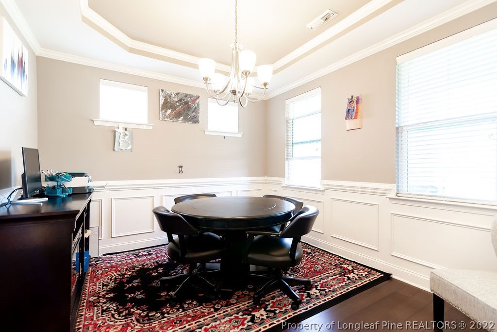 335 Turriff Way Cameron, NC 28326 - Photo 10 of 50 a dining room with a table and chairs