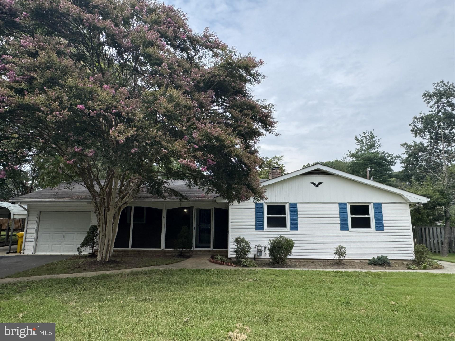 308 Benfield Road Severna Park, MD 21146 - Photo 1 of 1 a front view of a house with a yard and trees