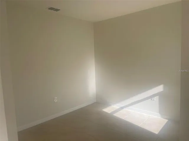 a kitchen with granite countertop a sink a stove and a granite counter top