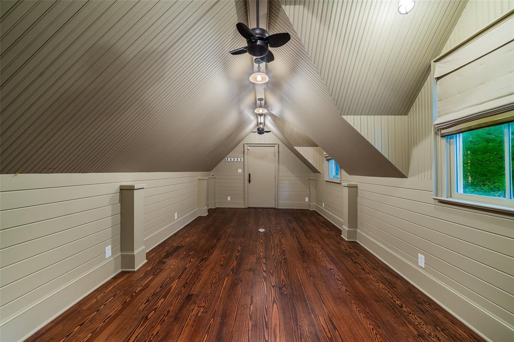 2315 Routh Street Dallas, TX 75201 - Photo 36 of 38 a view of a hallway with wooden floor and staircase