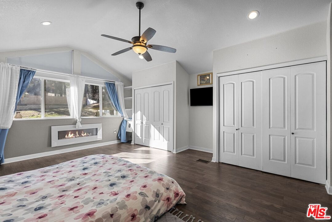 1197 Oriole Road Wrightwood, CA 92397 - Photo 35 of 50 a bedroom with a bed and wooden floor