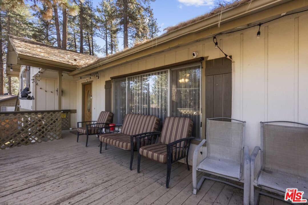 1197 Oriole Road Wrightwood, CA 92397 - Photo 37 of 50 a balcony with furniture and wooden floor