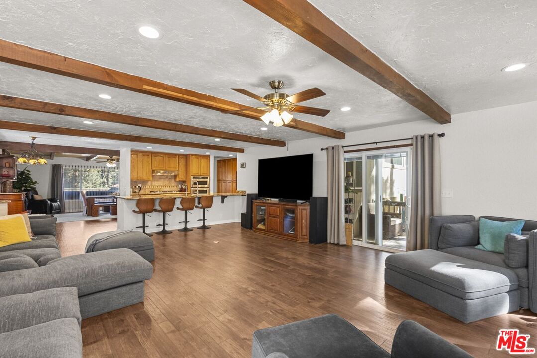 1197 Oriole Road Wrightwood, CA 92397 - Photo 5 of 50 a living room with furniture and a flat screen tv