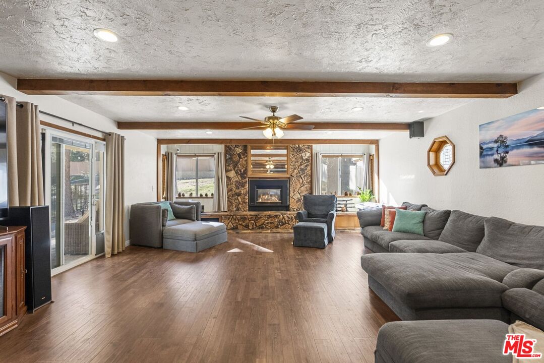 1197 Oriole Road Wrightwood, CA 92397 - Photo 9 of 50 a living room with furniture and wooden floor