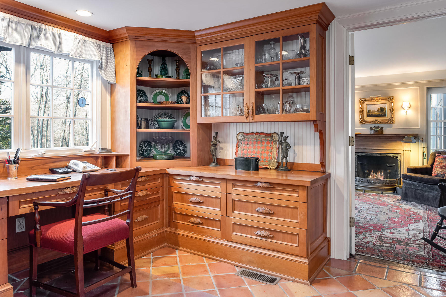 1403 Ponus Ridge Road New Canaan, CT 06840 - Photo 22 of 48 a dining room with a table and chairs