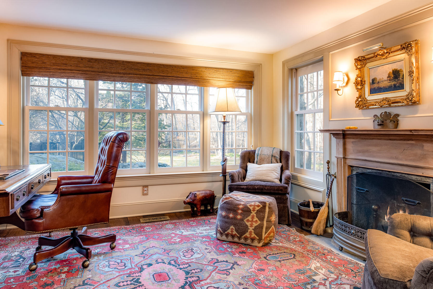 1403 Ponus Ridge Road New Canaan, CT 06840 - Photo 23 of 48 a living room with furniture and a fireplace