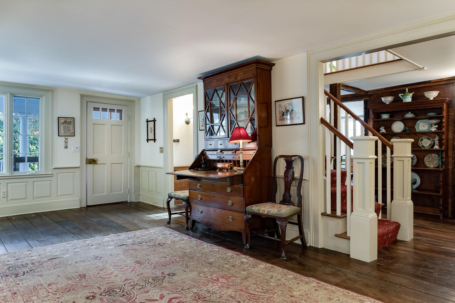 1403 Ponus Ridge Road New Canaan, CT 06840 - Photo 7 of 48 a room with lots of wooden furniture and a entryway