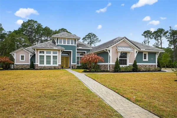 a front view of a house with yard