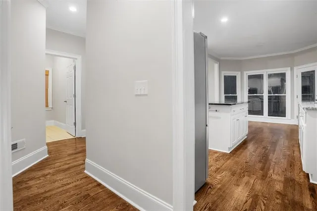 a bathroom with a sink toilet vanity and shower