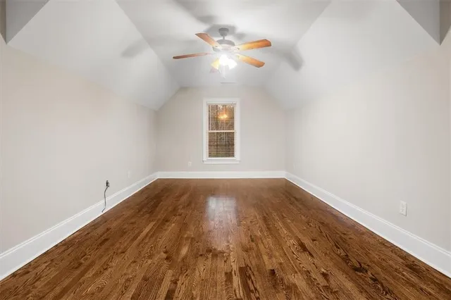 a bathroom with a granite countertop sink mirror and bathtub