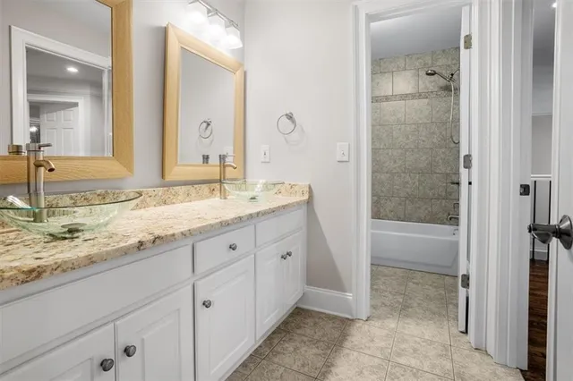a white bath tub sitting next to a white toilet