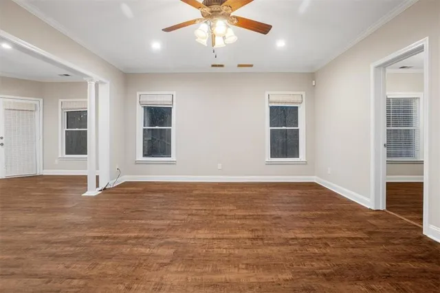 a view of an empty room with kitchen appliances
