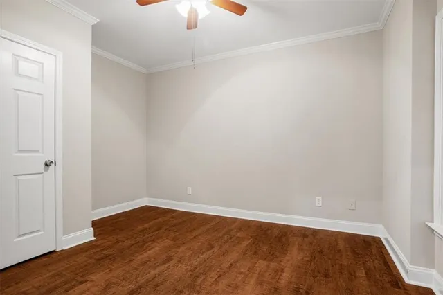 a bathroom with a toilet a sink a mirror and vanity