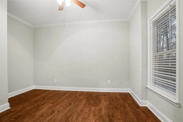 a view of balcony with wooden floor and fence