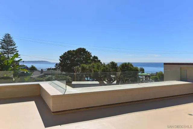 a view of a balcony with lake view and mountain view