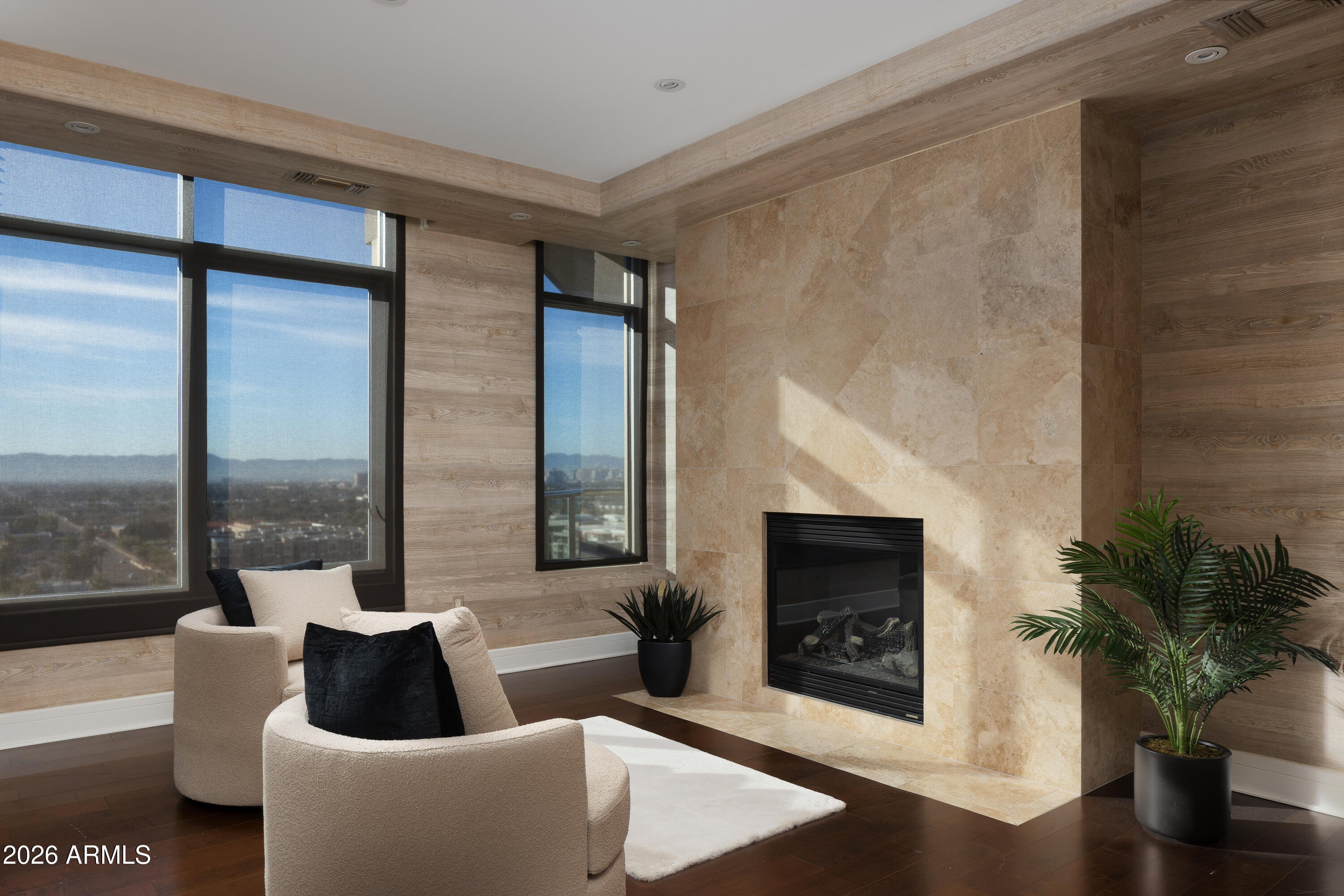 2402 East Esplanade Lane, Unit PH2 Phoenix, AZ 85016 - Photo 11 of 40 a living room with furniture and a fireplace