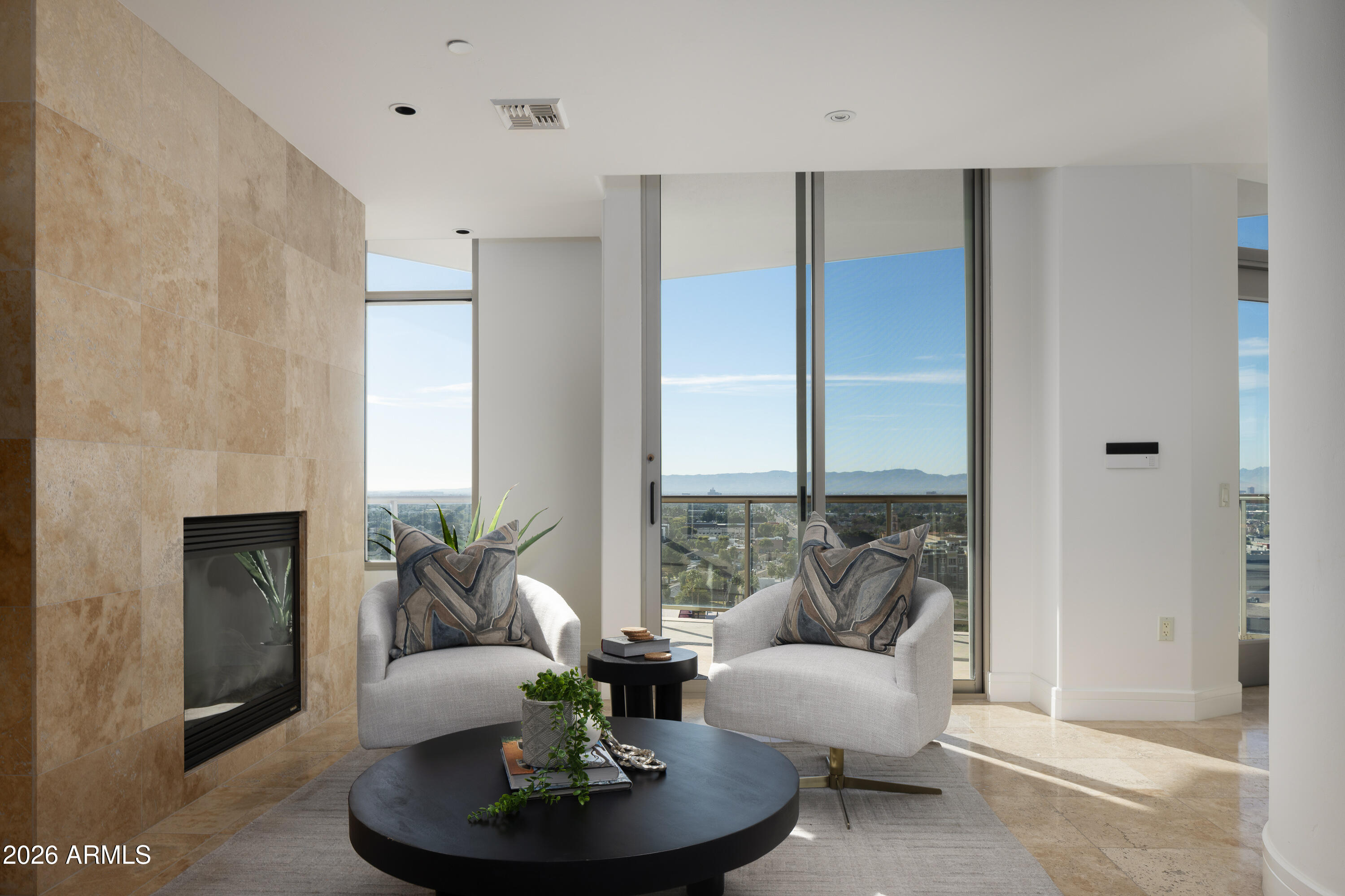 2402 East Esplanade Lane, Unit PH2 Phoenix, AZ 85016 - Photo 20 of 40 a living room with furniture and a fireplace