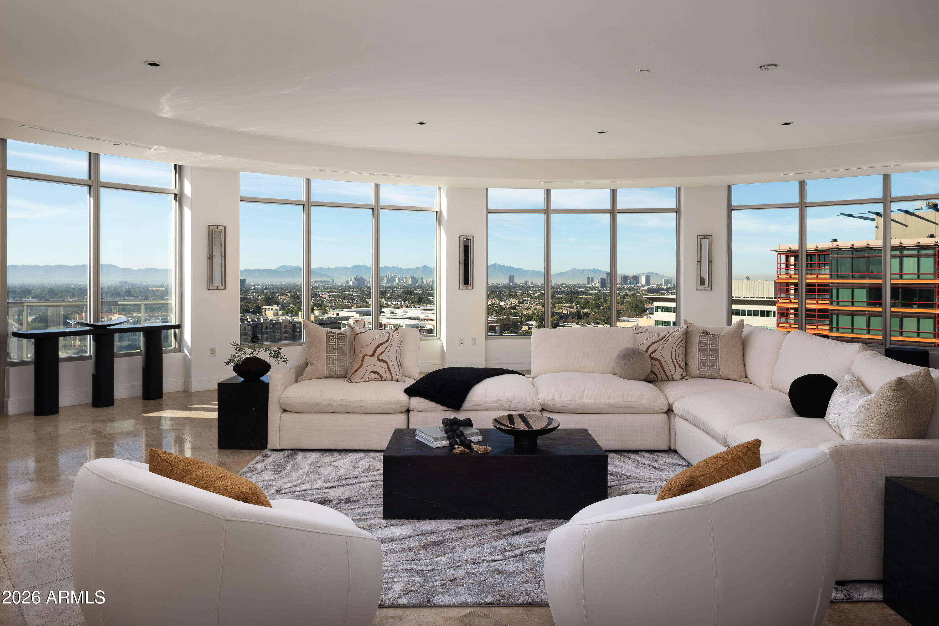 2402 East Esplanade Lane, Unit PH2 Phoenix, AZ 85016 - Photo 2 of 40 a living room with furniture and a large window