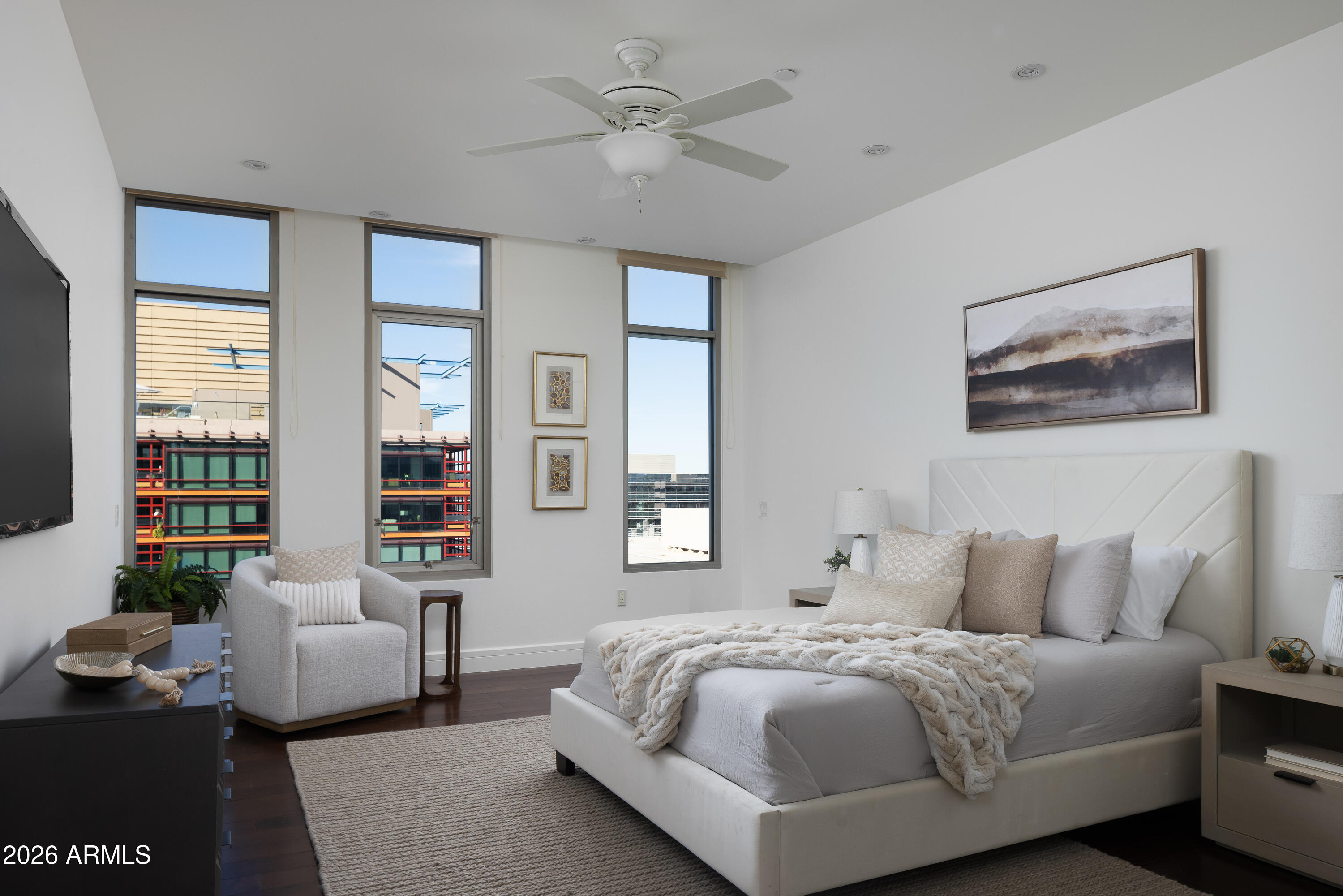 2402 East Esplanade Lane, Unit PH2 Phoenix, AZ 85016 - Photo 22 of 40 a spacious bedroom with a bed and a couch