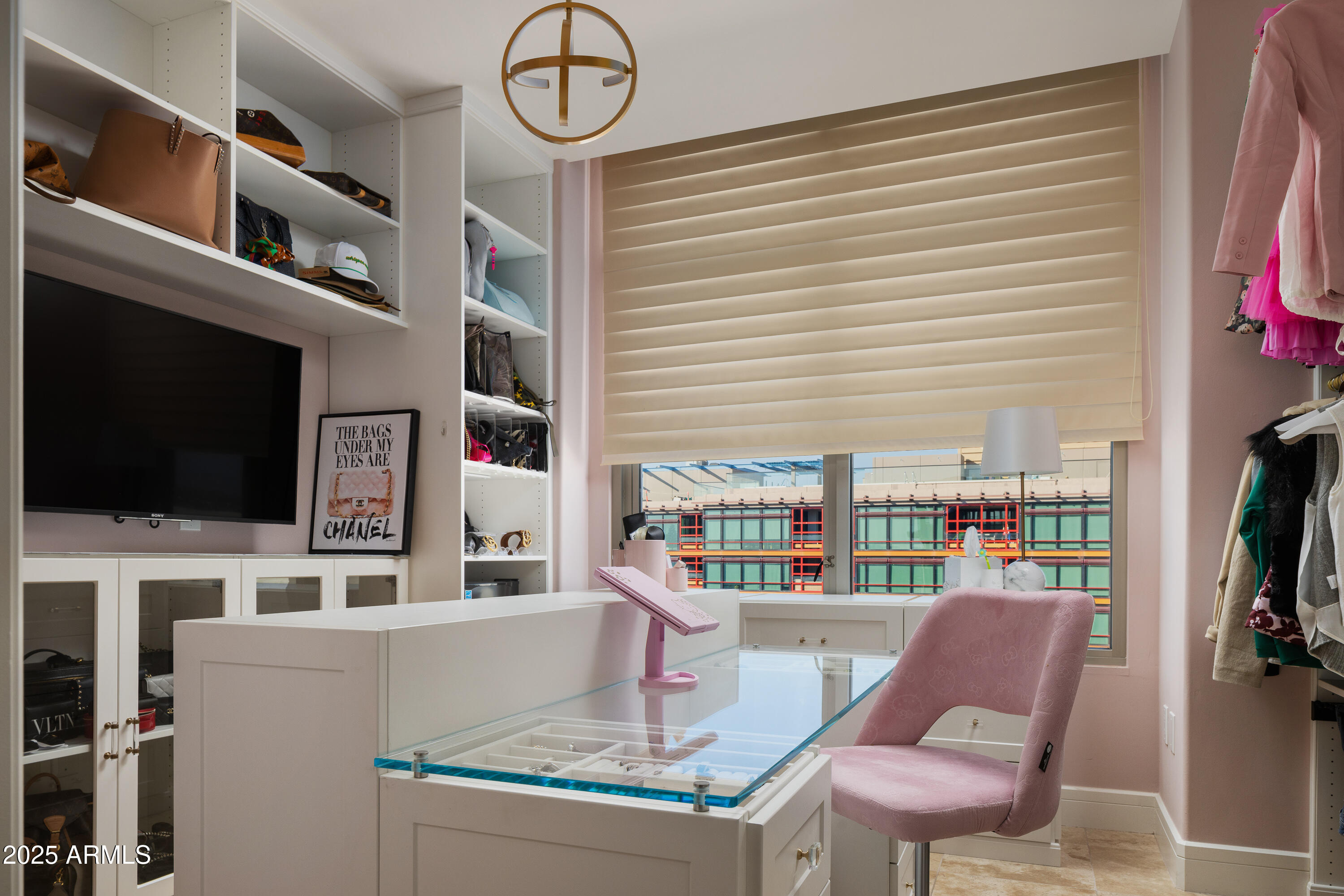 2402 East Esplanade Lane, Unit PH2 Phoenix, AZ 85016 - Photo 27 of 40 a work place with furniture and a flat screen tv