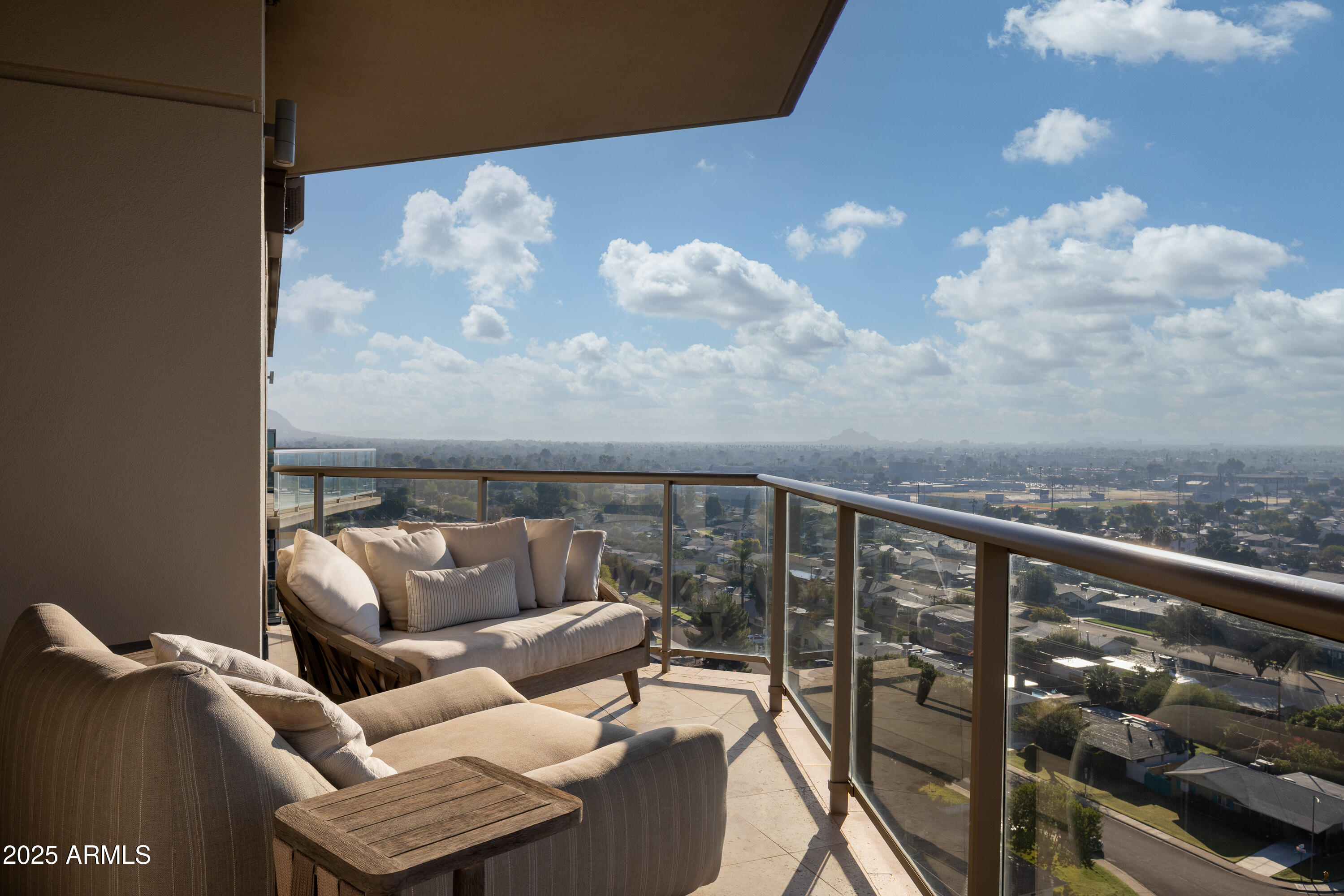 2402 East Esplanade Lane, Unit PH2 Phoenix, AZ 85016 - Photo 30 of 40 a balcony with table and chairs