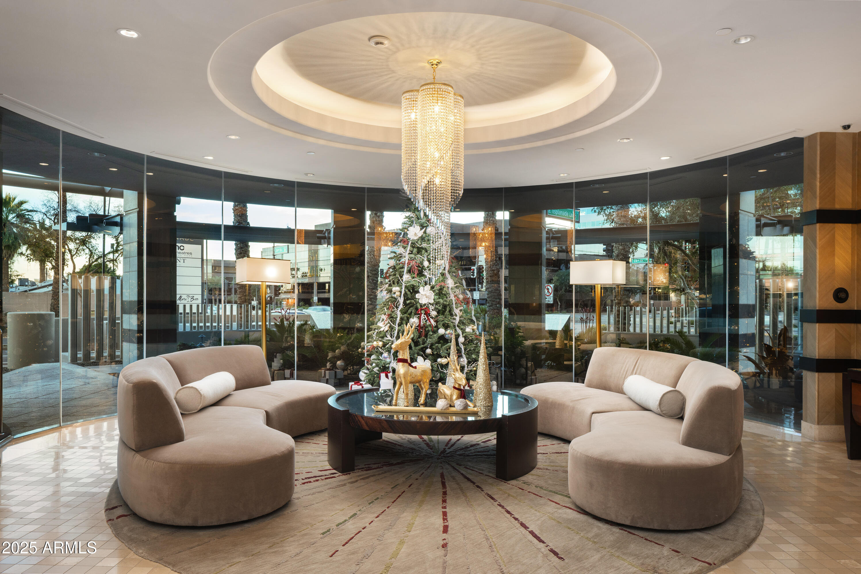 2402 East Esplanade Lane, Unit PH2 Phoenix, AZ 85016 - Photo 36 of 40 a very nice looking living room with a large window and a chandelier