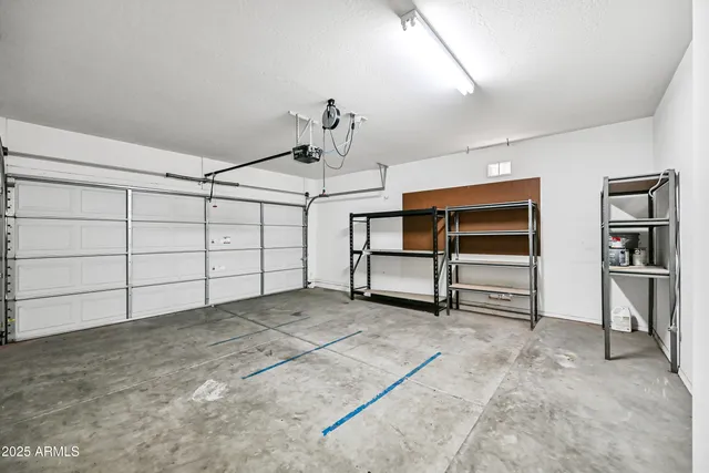 a view of a livingroom with furniture and staircase