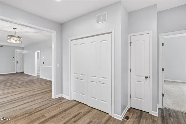 wooden floor with white walls