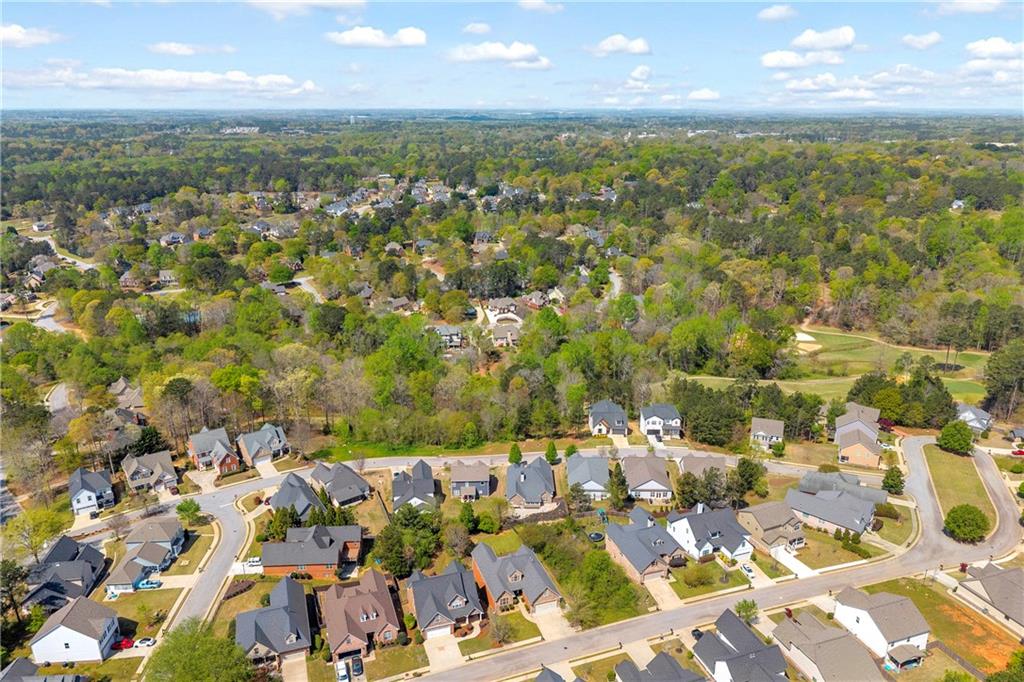 9147 Golfview Lane Covington, GA 30014 - Photo 3 of 19 an aerial view of residential building with parking space