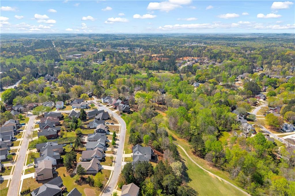 9147 Golfview Lane Covington, GA 30014 - Photo 5 of 19 an aerial view of residential houses with outdoor space and trees