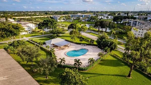 an aerial view of a house with a swimming pool