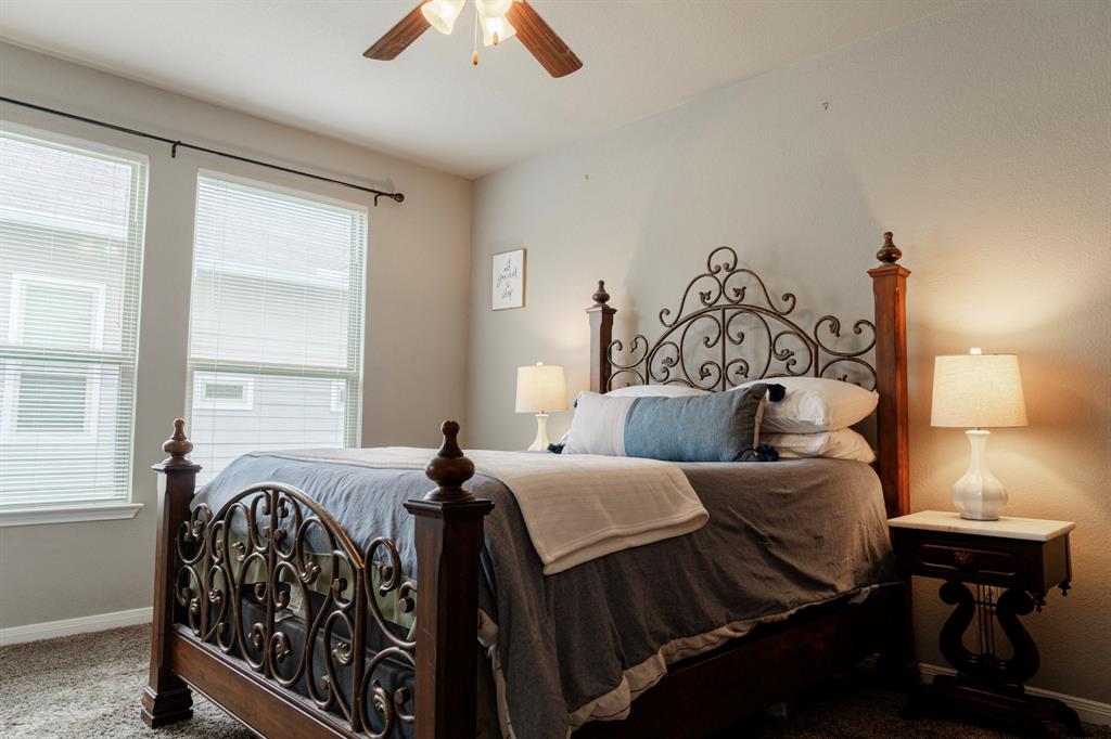 2716 Beutel Road Lorena, TX 76655 - Photo 15 of 39 a bedroom with a bed and a table in it