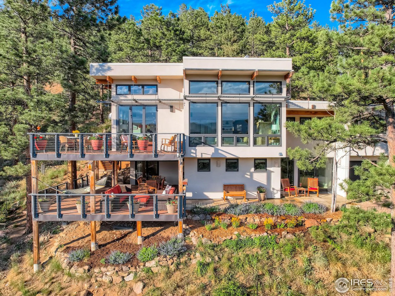 153 Poorman Road Boulder, CO 80302 - Photo 1 of 40 a front view of a building with street view