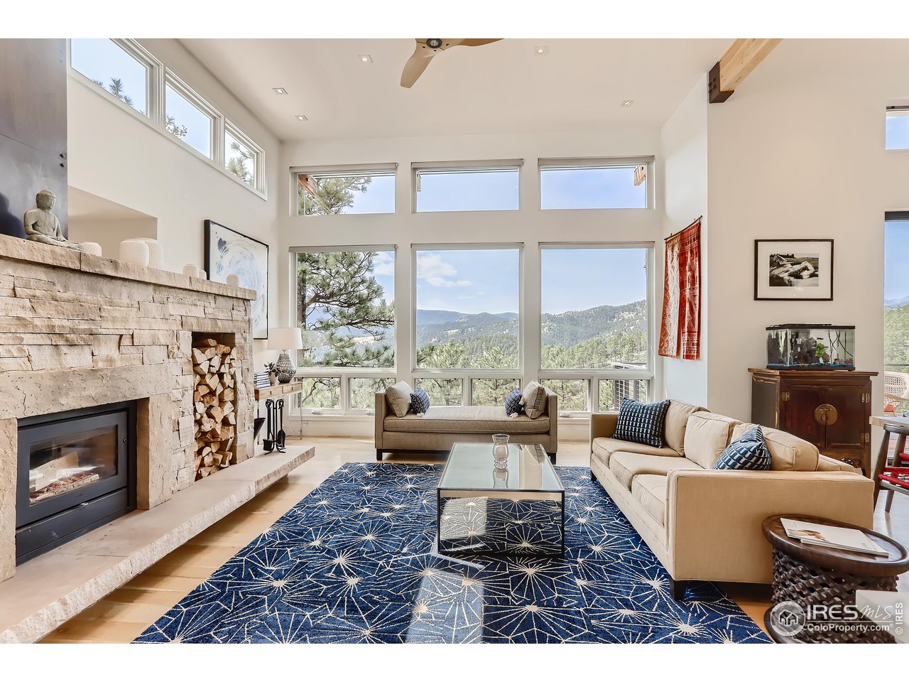 153 Poorman Road Boulder, CO 80302 - Photo 14 of 40 a living room with furniture large window and fireplace