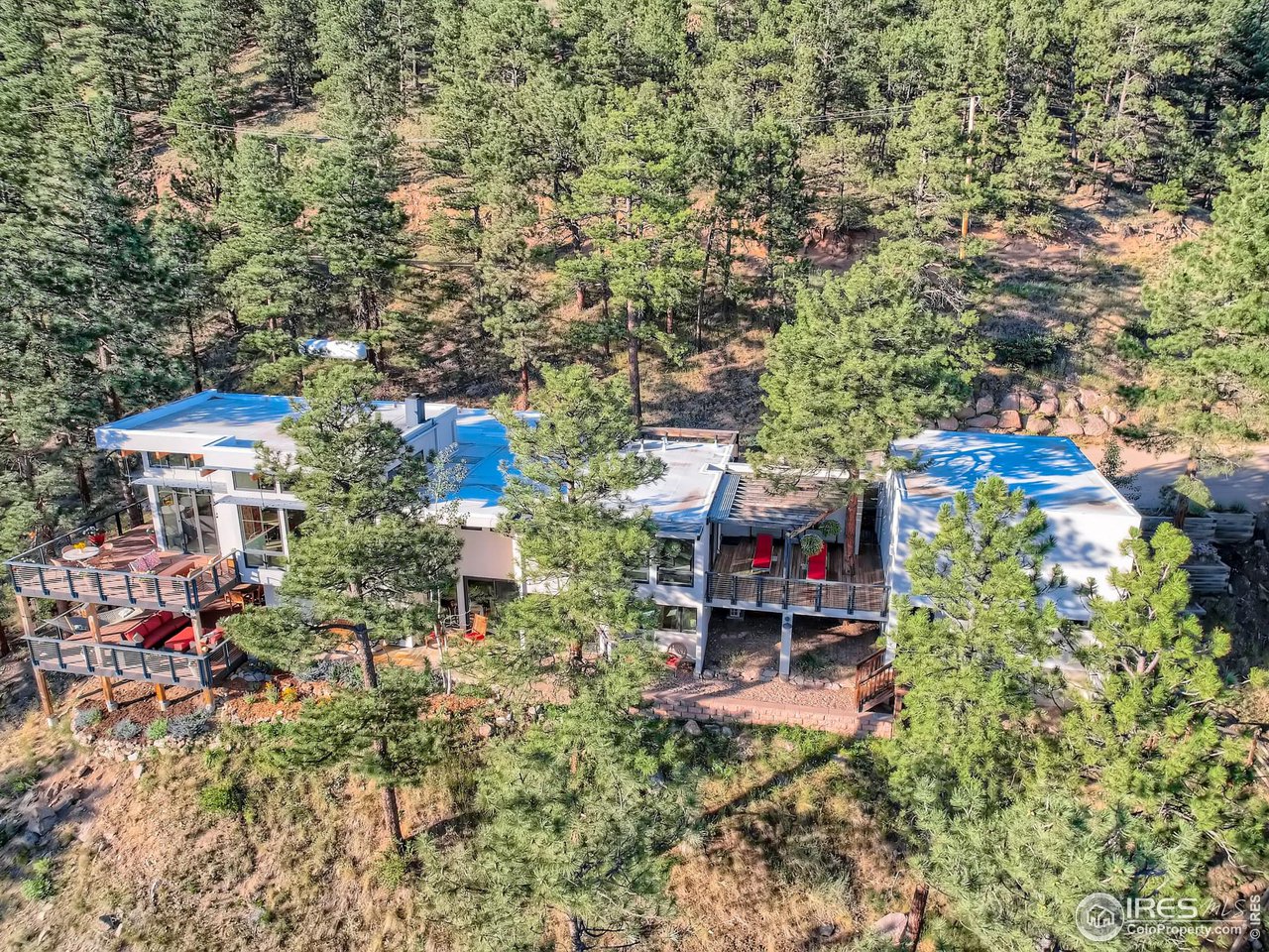 153 Poorman Road Boulder, CO 80302 - Photo 2 of 40 an aerial view of a house with a yard and sitting area