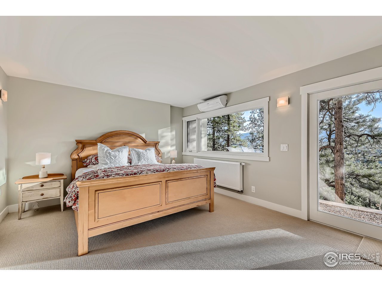 153 Poorman Road Boulder, CO 80302 - Photo 30 of 40 a bed room with a bed and a painting on the wall